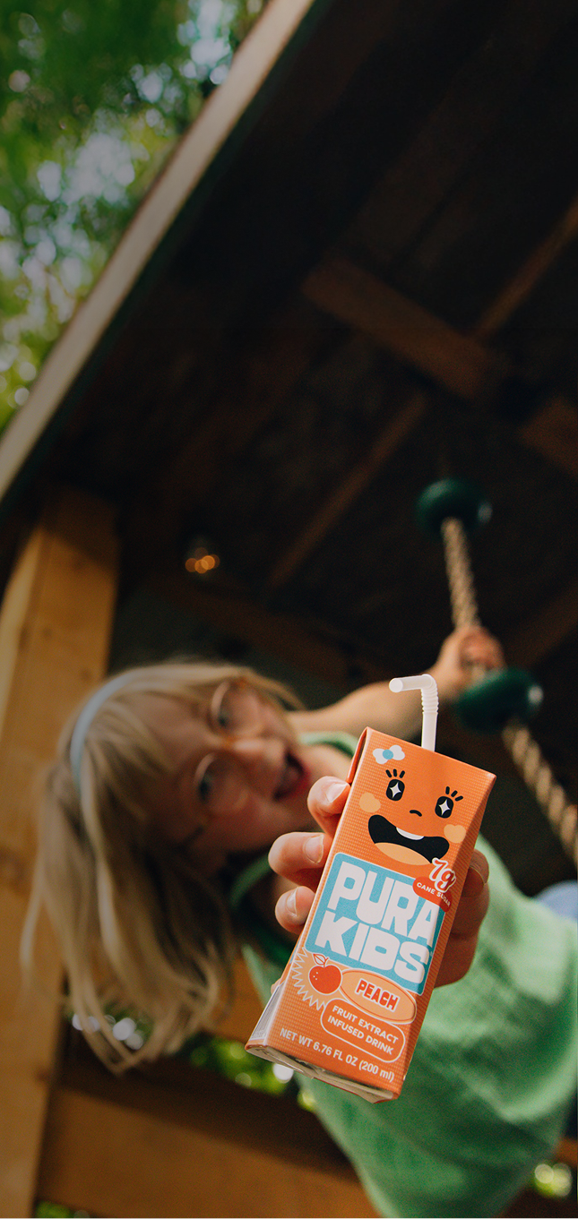 Pura Kids Playing with Peach Drink Banner